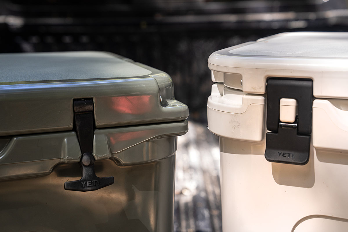 A photo of different type of cooler latches, including t-handle latch, and Yeti's quicklatch system.