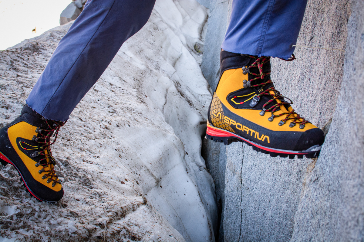 A climber smears up the rock using the sticky toe on his mountaineering boots.